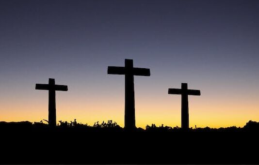 Landscape View of 3 Cross Standing during Sunset